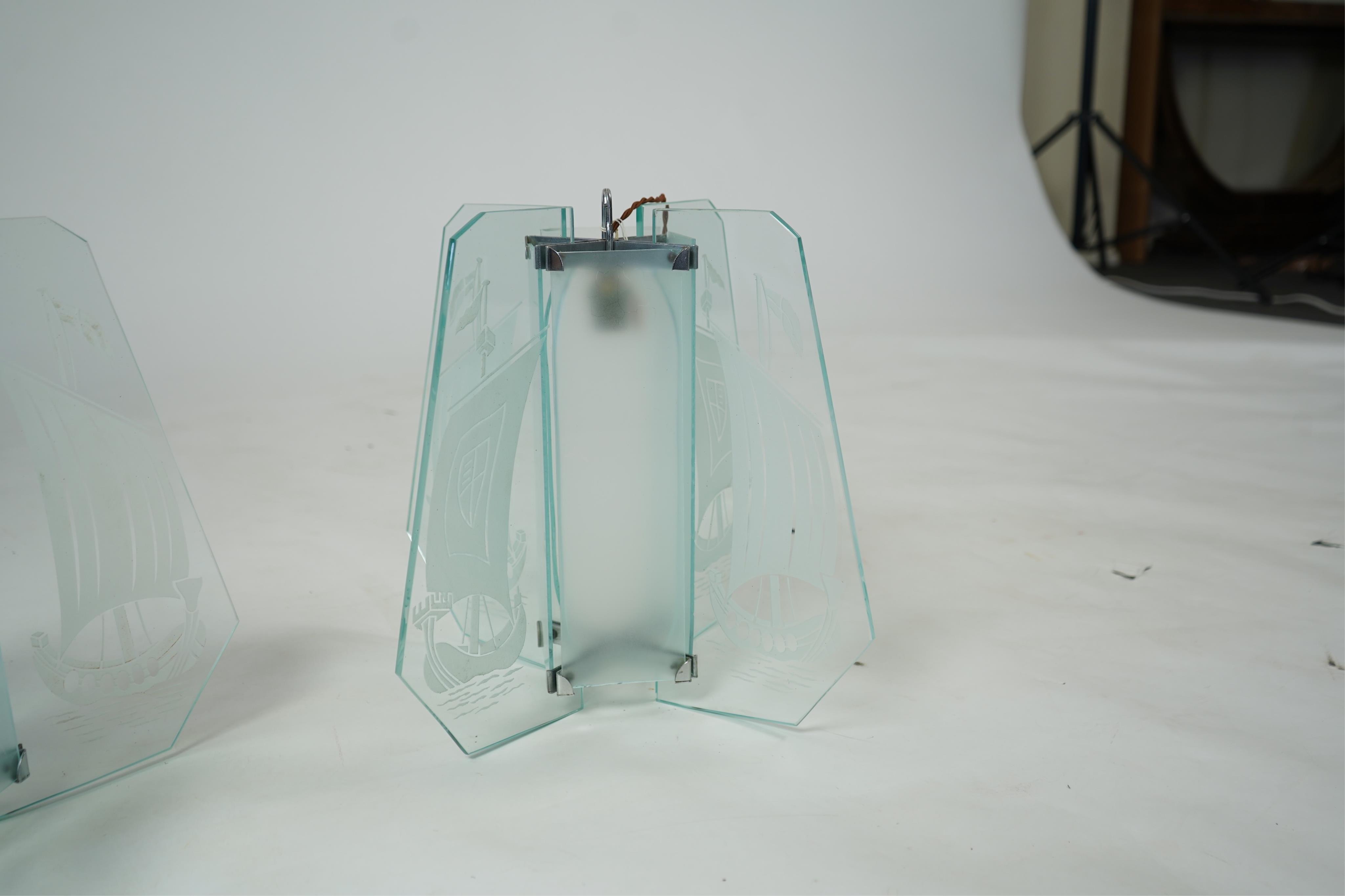 A pair of Art Deco chrome and four panelled etched glass ‘Galleon’ designed celling pendant lights